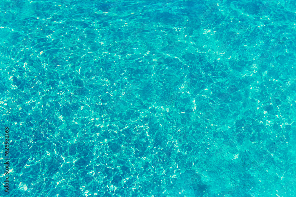 texture of blue water in the pool close-up, there is a place for an inscription