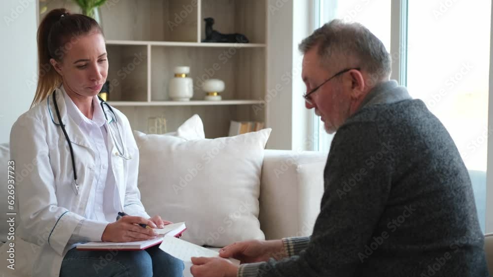 Female doctor examining older senior man in doctor office or at home. Old man patient and doctor have consultation in hospital room. Medicine healthcare medical checkup. Visit to doctor Female doctor examining older senior man in doctor office or at home. Old man patient and doctor have consultation in hospital room. Medicine healthcare medical checkup. Visit to doctor