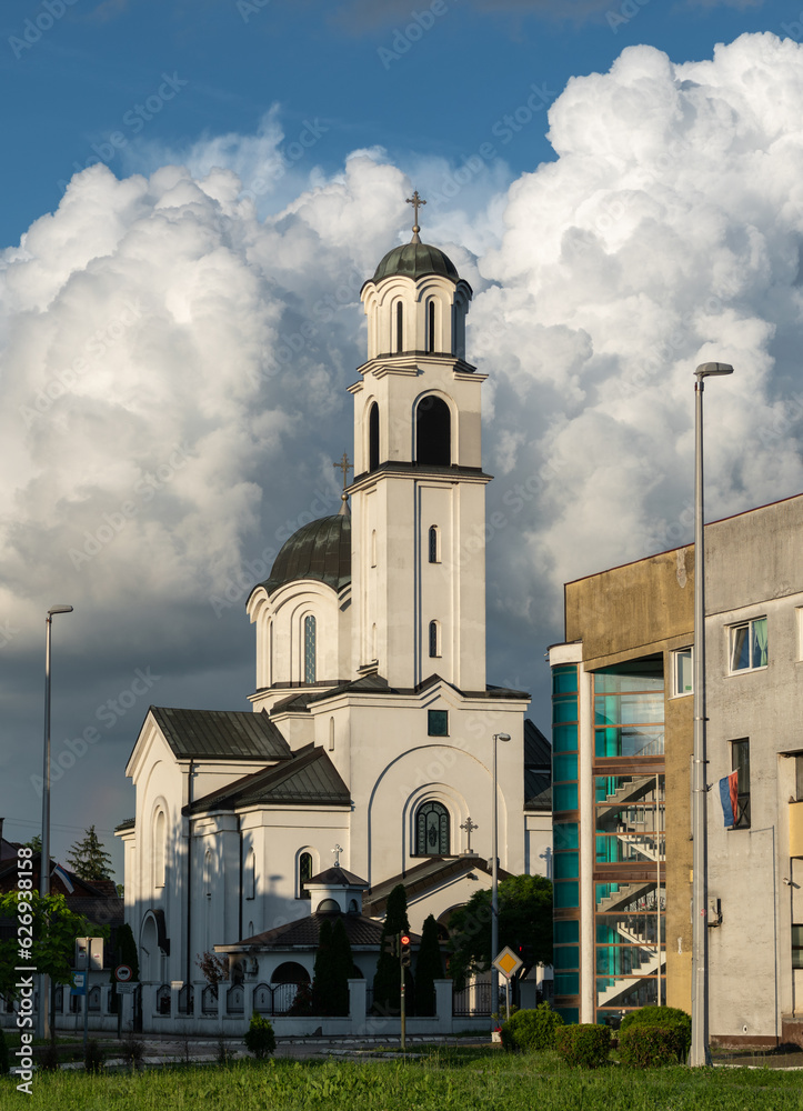 Orthodox church against big bright cloud