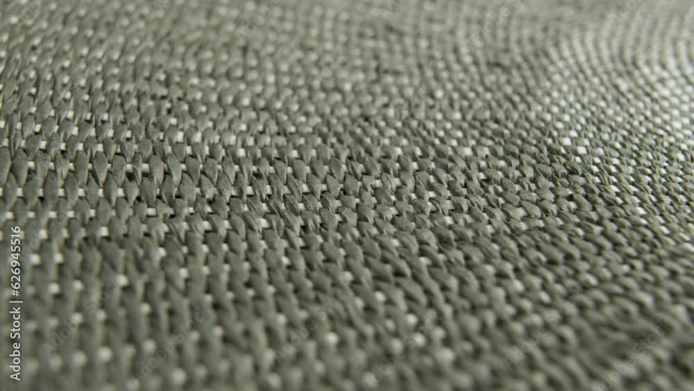 Braided wattled fiber of kitchen mat. Textural wicker surface. Rotation. Macro shot