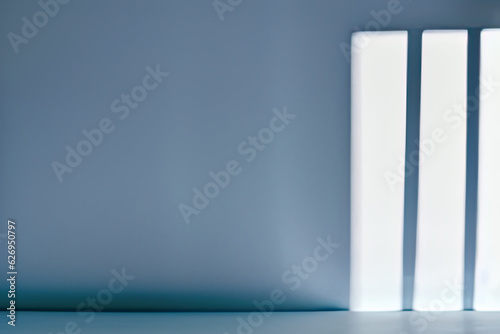 Minimalistic background, light blue color. Shadow and light from windows. Background for product presentation
