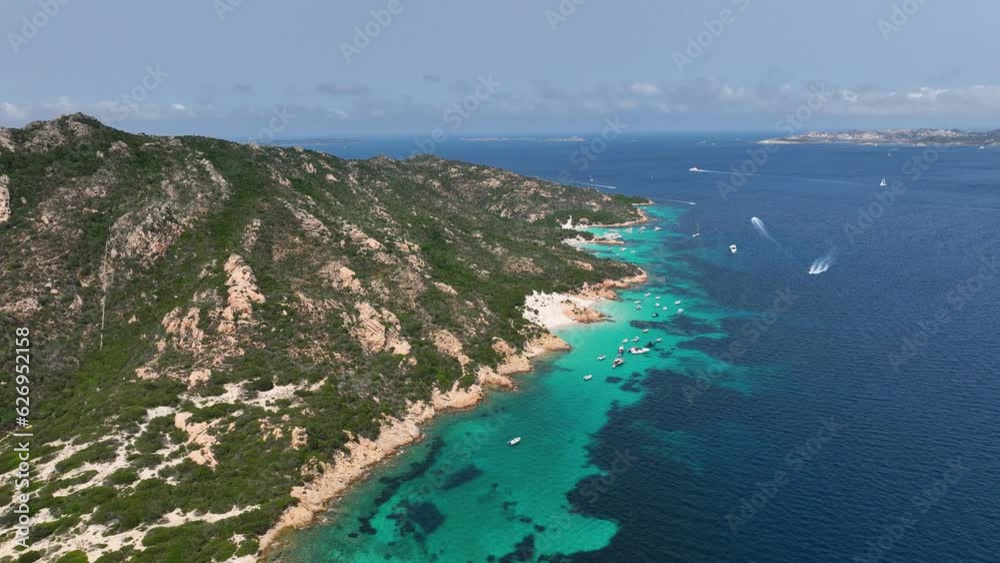 View from the air on the waves and rocks. Sea relaxation and travel. Azure water on the sea. A bright sunny day during a summer vacation. Top view at the day time.