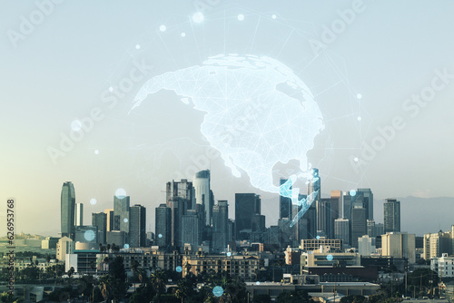 Virtual digital map of North America on Los Angeles skyline background, international trading concept. Multiexposure