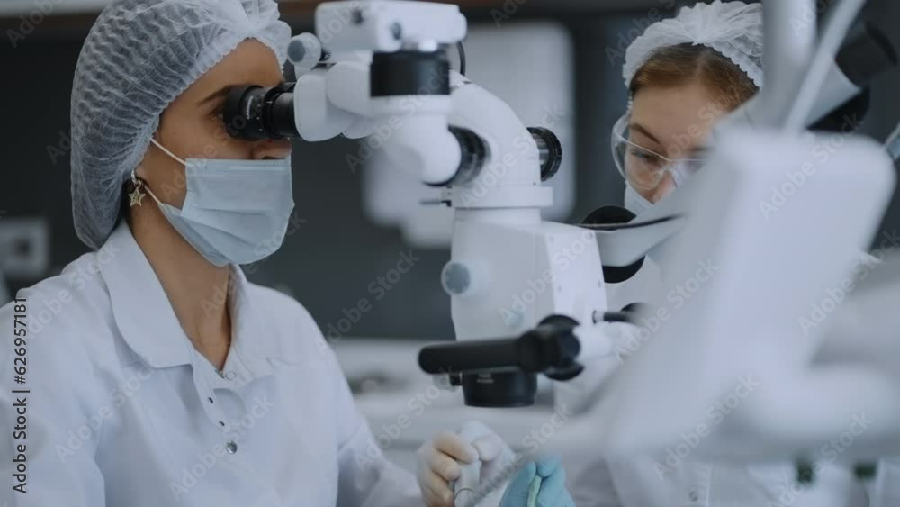 Modern Operating Microscope For Dental And Laparoscopic Operation, Female Doctor Looking Inside