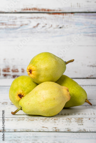 Pear on a white wood background. Fresh pear harvest season concept. Healthy and fresh fruit. Close up