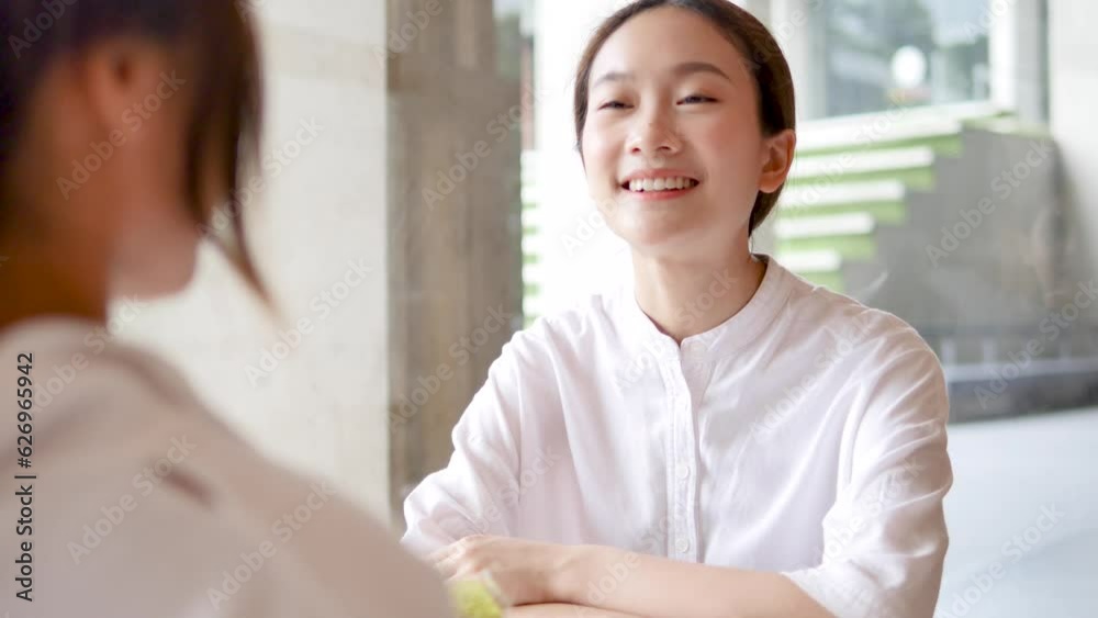 Asian business woman with customers in coffee shop Asian business woman with customers in coffee shop