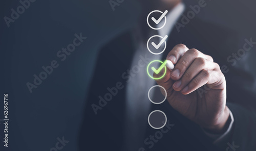 Canvastavla Businessman touching to tick correct sign mark in checkbox for quality document control checklist and business approve project concept