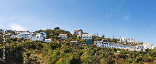 panoramaic landscape of desirable clifftop holiday cottages in Cornwall