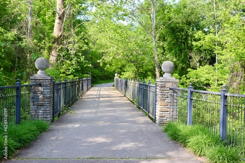 The footbridge in the park on a sunny day.