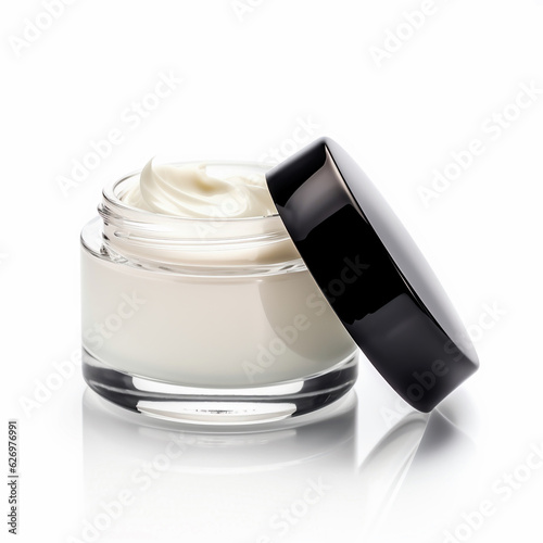 White face cream in a jar with black cover on white background.