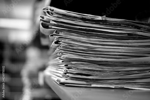 Stacks of Old Newspapers Printed Paper with News Headlines