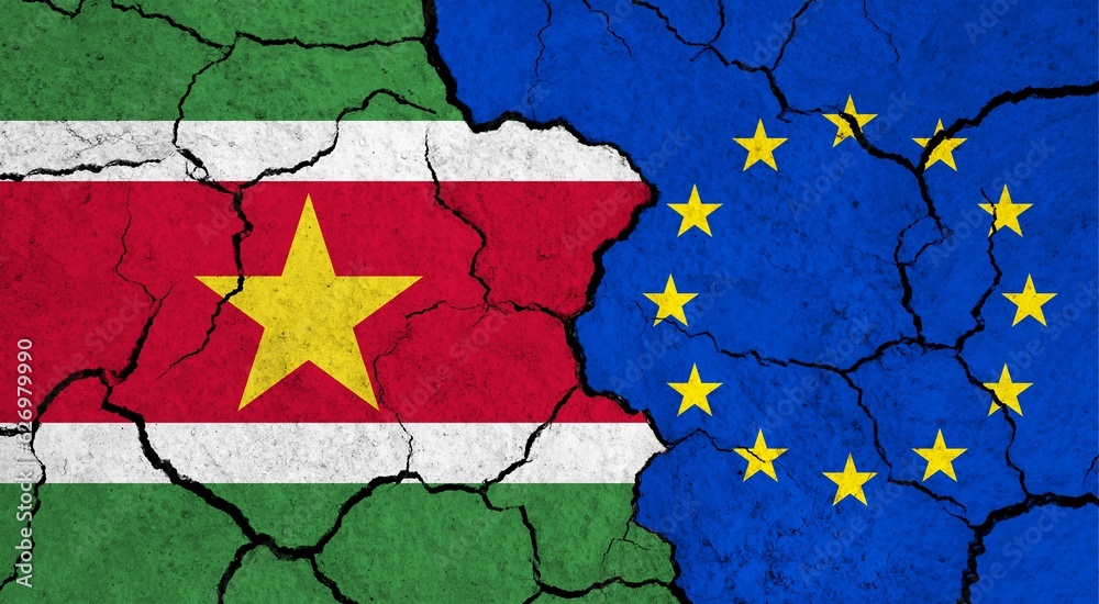 Flags of Suriname and European Union on cracked surface - politics, relationship concept