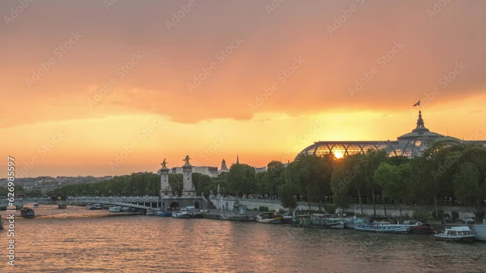 Paris France time lapse 4K, city skyline day to night sunset timelapse at Seine River with Pont Alexandre III bridge and Grand Palais Paris France time lapse 4K, city skyline day to night sunset timelapse at Seine River with Pont Alexandre III bridge and Grand Palais