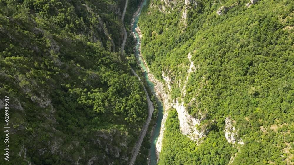 The drone flies over a huge, deep canyon, flanked by green mountains and rocks. Canyon of the Tara River. Montenegro. Aerial view. The drone flies over a huge, deep canyon, flanked by green mountains and rocks. Canyon of the Tara River. Montenegro. Aerial view.