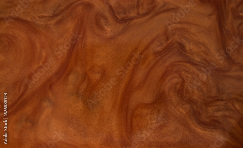 Beautiful smooth wavy brown satin, silk luxury cloth fabric texture, abstract background design.