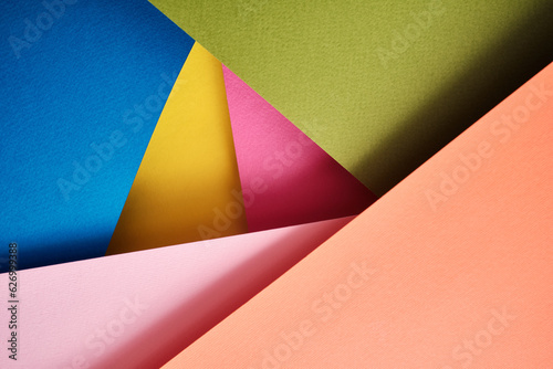 Abstract texture of colored paper. Geometric shapes and lines in bright colors. Place for text. Multicolor abstract flat lay. Back to school concept. Copy space, top view