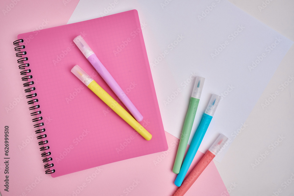 Top view of blank notepads, pen and markers. Mockup. The concept of office and school supplies, school year Top view of blank notepads, pen and markers. Mockup. The concept of office and school supplies, school year