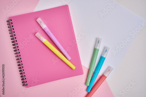 Top view of blank notepads, pen and markers. Mockup. The concept of office and school supplies, school year