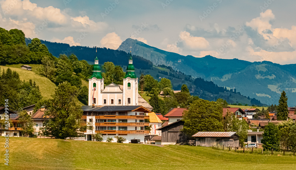 Alpine summer view with a church at Brixen im Thale, Kitzbuehel, Tyrol, Austria