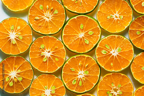 macro orange,Abstract background of orange citrus slices on white.