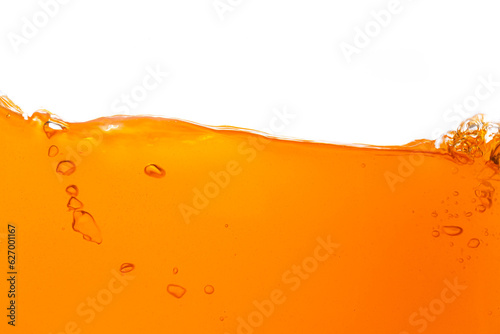 Macro orange juice texture isolated white background,Close-up Orange juice with bubbles on a white background.