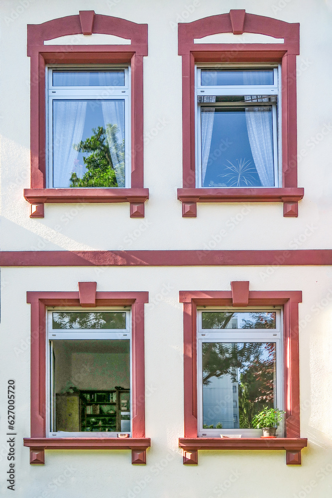 detail of classicistic window at house facade