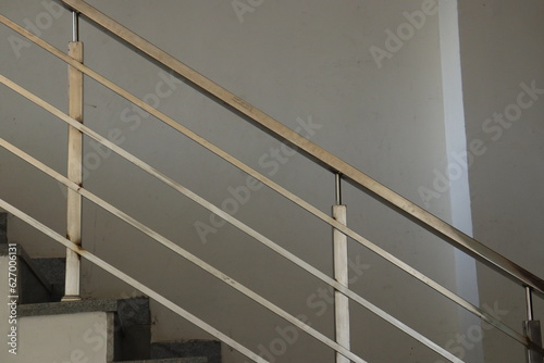 Silver Aluminium Stairs Railing around a White Wall