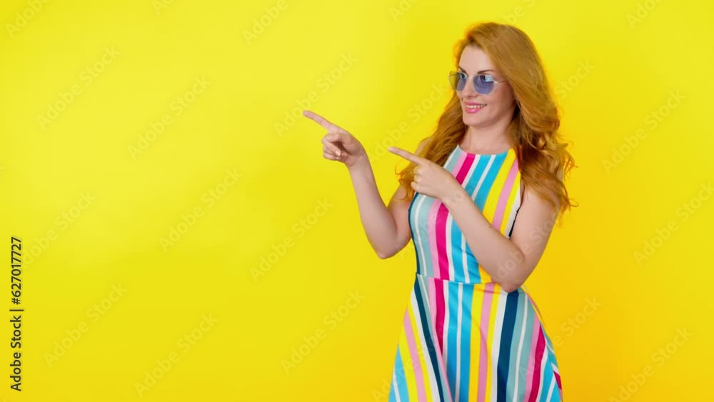 Woman and pointing at mockup workspace for advert, marketing, promotion or text. Fashionable model showing mock up for advertising, news deal of offer, trendy makeup, outfit, studio yellow background Woman and pointing at mockup workspace for advert, marketing, promotion or text. Fashionable model showing mock up for advertising, news deal of offer, trendy makeup, outfit, studio yellow background