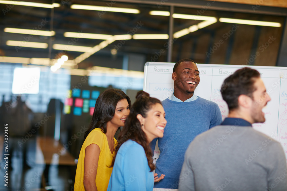 Success keeps the positivity alive. Cropped shot of a group of businesspeople talking in the boardroom. Success keeps the positivity alive. Cropped shot of a group of businesspeople talking in the boardroom.