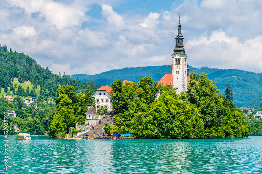 A view across Lake Bled from the southern shore towards the island in Bled, Slovenia in summertime