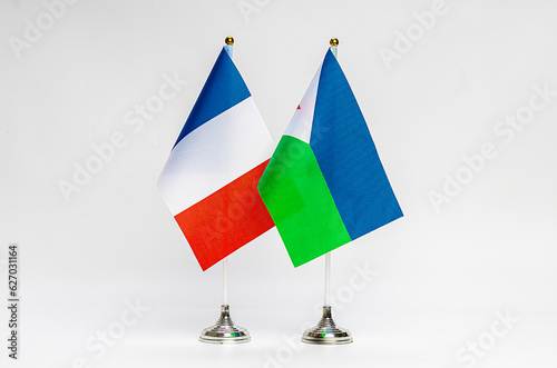 National flags of France and Djibouti on a light background. photo