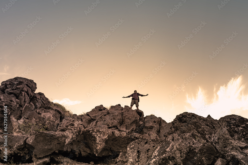 Hiker enjoying freedom on a mountain top 