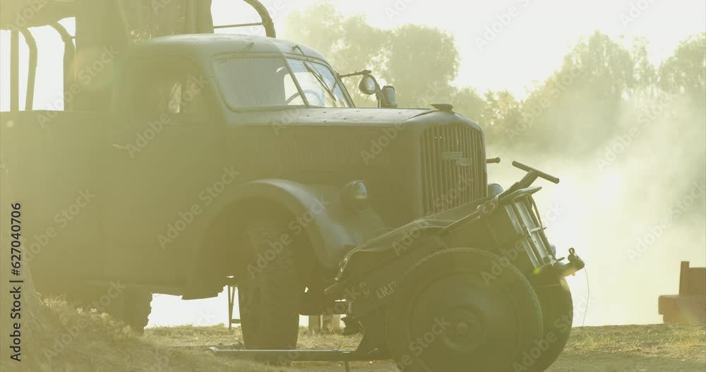 German World War Ii Automotive. German Military Ammunition. Close-up On German Vehicle Truck Opel Blitz And German Infantry Cart Or Handcart Infanteriekarren If8 Of World War Ww Ii. Autumn Sunny Day.