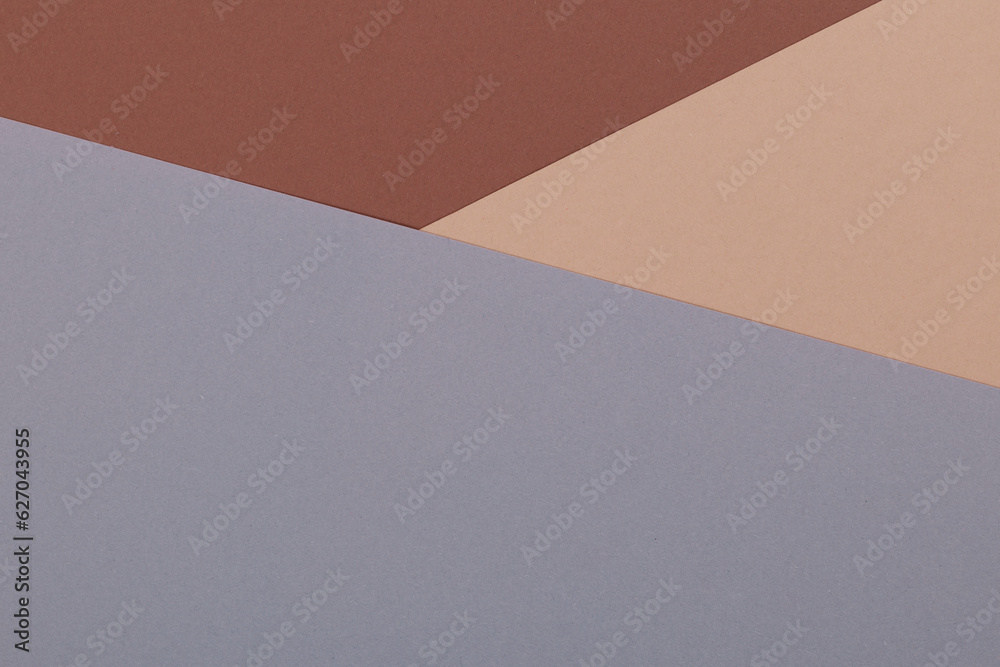 Multicolor background from a paper of different shades of brown and gray. Geometric backdrop. Multicolor background from a paper of different shades of brown and gray. Geometric backdrop.