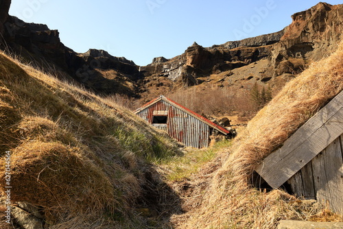 View of an abandoned house in the village of Kalfafell located in the south of Iceland photo