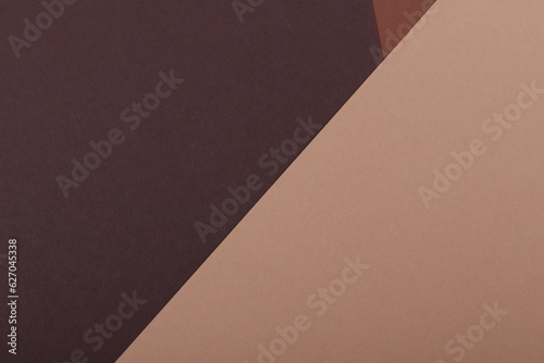 Multicolor background from a paper of different shades of brown. Geometric backdrop.