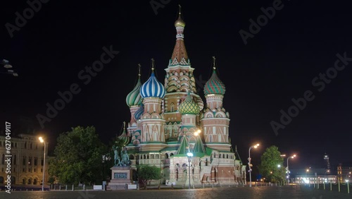 Illuminated St. Basils cathedral and monument to Minin and Pozharsky at night from Red Square timelapse hyperlapse in Moscow, Russia