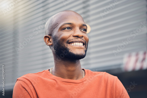 Black man, smile and thinking outdoor on a city street with a positive mindset, idea and opportunity. Face of happy African person or student on an urban road with casual style and freedom on travel