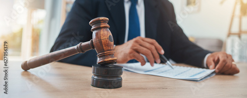 Fotografie Documents, judge and gavel with hands of man in lawyer office for justice at legal hearing