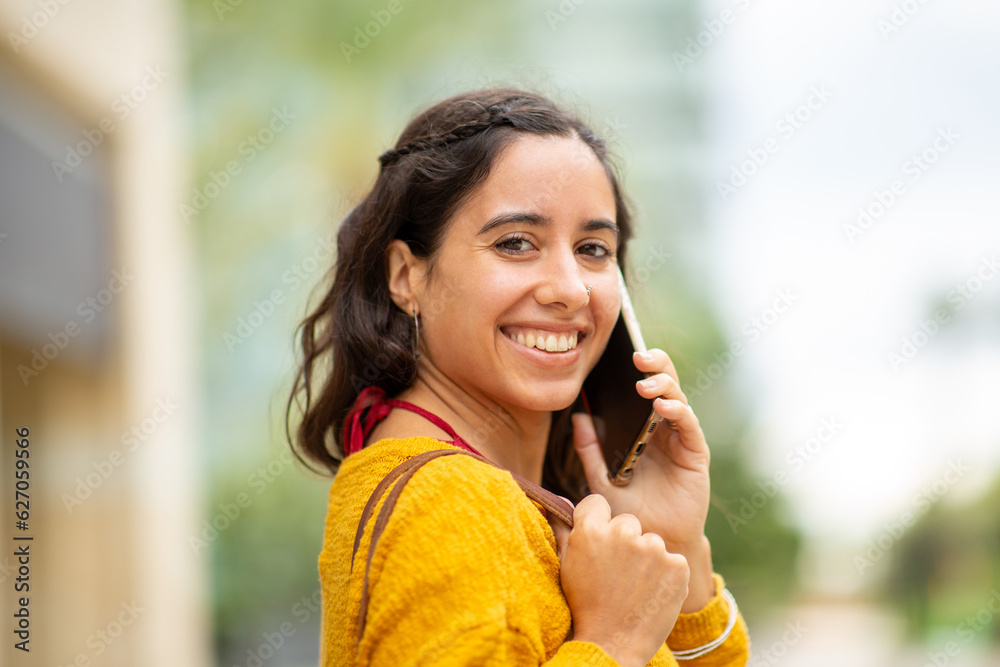 young woman talking with cellphone