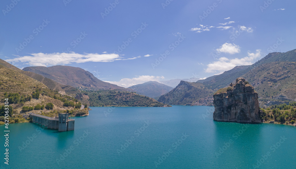 Reservoir at full capacity. Aerial view of a water reserve for human use. Panoramic view. Water reserves for human consumption. Andalusia. Spain.