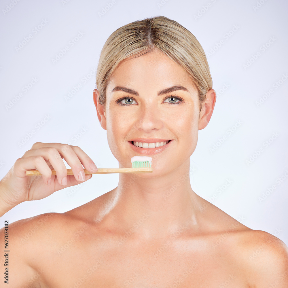 Portrait, woman and brushing teeth in studio for healthy dental wellness on background. Face of female model, bamboo toothbrush and cleaning mouth for fresh breath, oral hygiene and care for smile Portrait, woman and brushing teeth in studio for healthy dental wellness on background. Face of female model, bamboo toothbrush and cleaning mouth for fresh breath, oral hygiene and care for smile