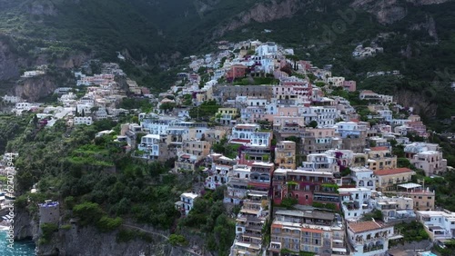 Wallpaper Mural Positano, tourist destination on the Amalfi Coast, Italy. Aerial view of Colorful houses on a Tyrrhenian sea coast seen through green juicy flora in Positano is a village in Naples metropolitan area Torontodigital.ca