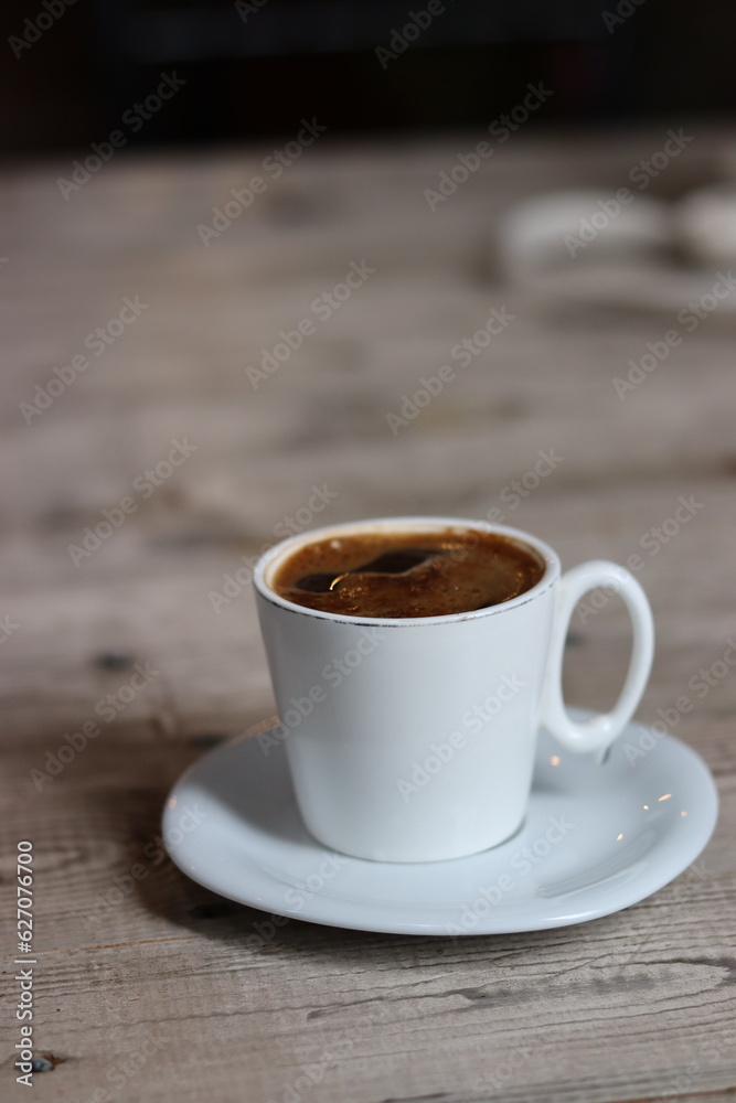 Fototapeta premium cup of coffee on wooden table