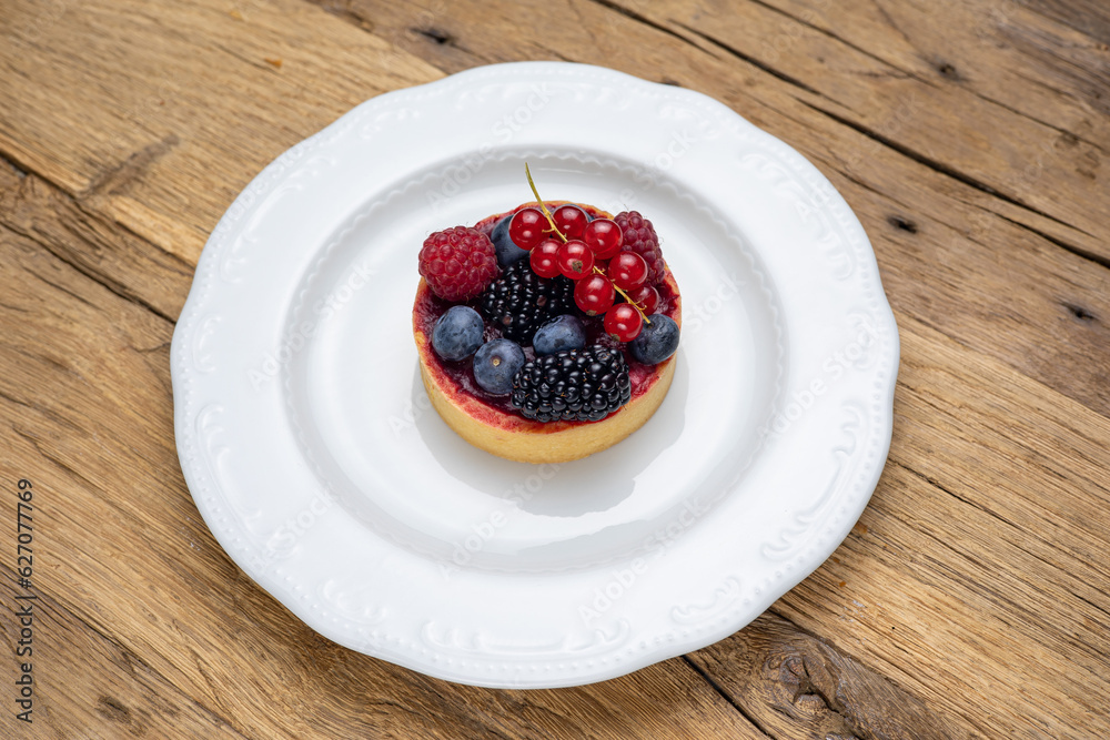 Delicious flavored pastries on a wooden table. Close up Delicious flavored pastries on a wooden table. Close up