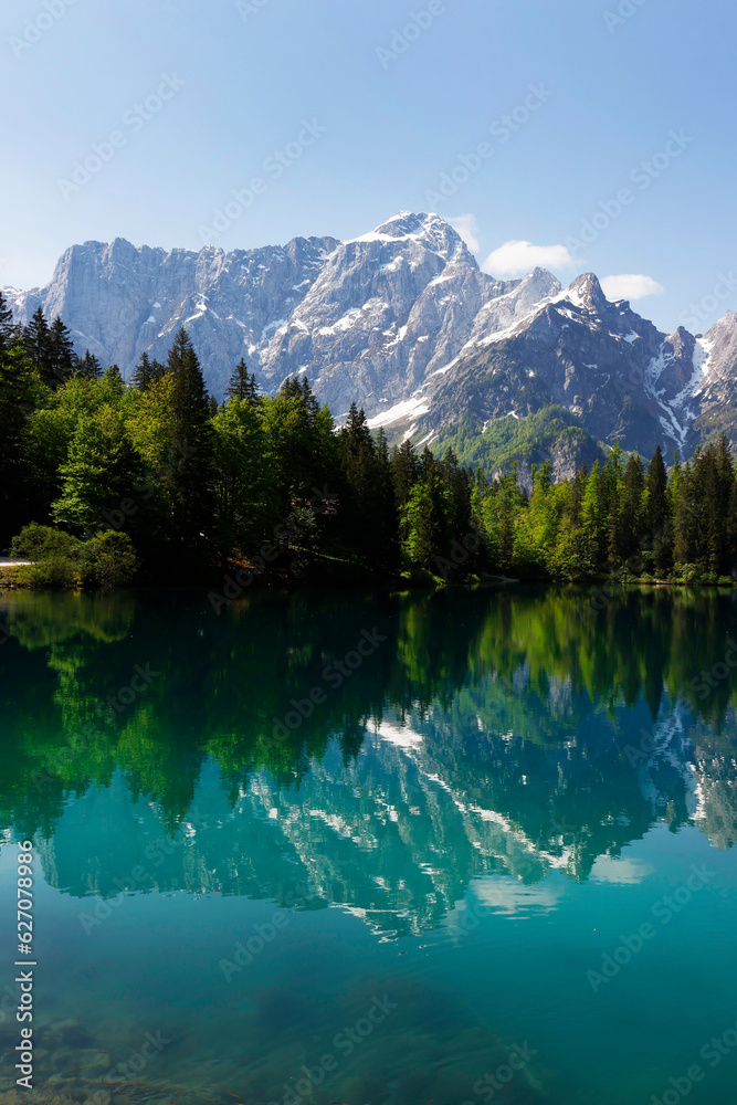 Mountain Range and the peak of the Mount Mangart (2677 m) seen from Fusine Lake, Julian Alps, Tarvisio, Udine, Friuli Venezia Giulia, Italy Slovenia border, Europe