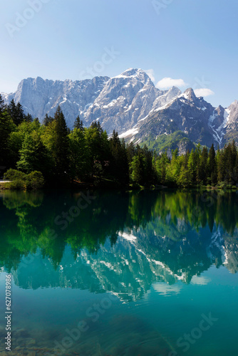 Mountain Range and the peak of the Mount Mangart (2677 m) seen from Fusine Lake, Julian Alps, Tarvisio, Udine, Friuli Venezia Giulia, Italy Slovenia border, Europe