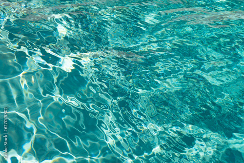 defocused turquoise ripple pool blured background. photo of defocused turquoise pool