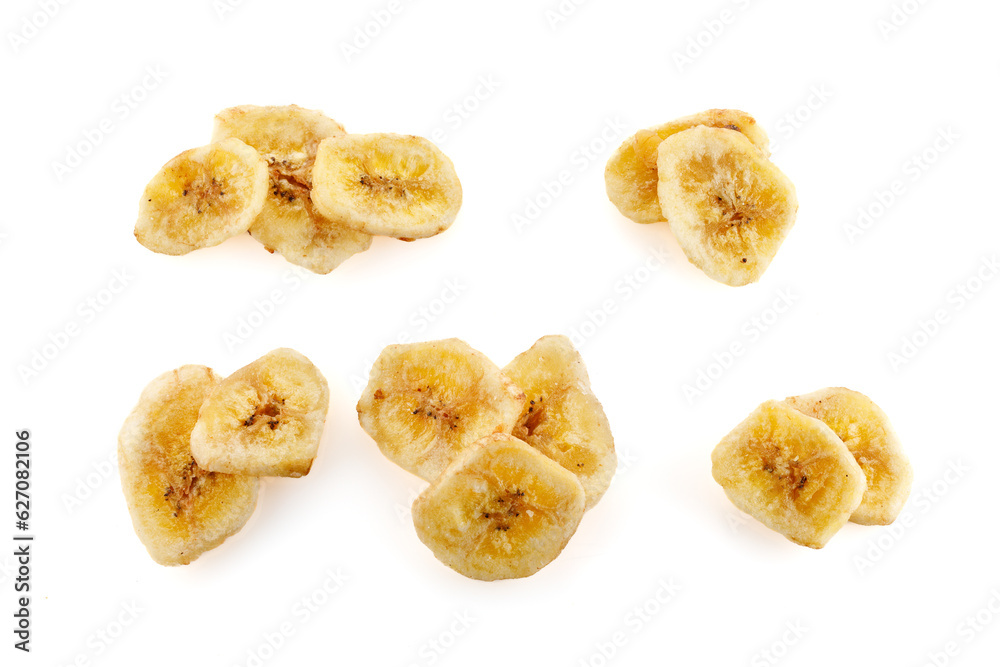 Baked and dried banana chip slice isolated over the white background. Dried banana slices in high resolution. Banana chips. Close-up Baked and dried banana chip slice isolated over the white background. Dried banana slices in high resolution. Banana chips. Close-up