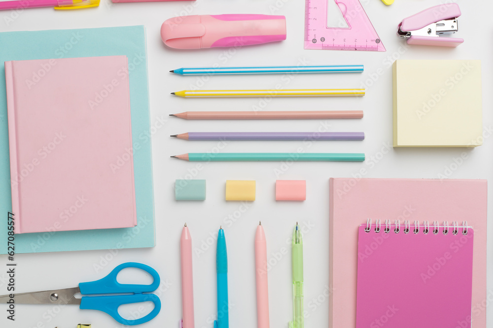 Flat lay with colorful school stationery on white backgroung, top view